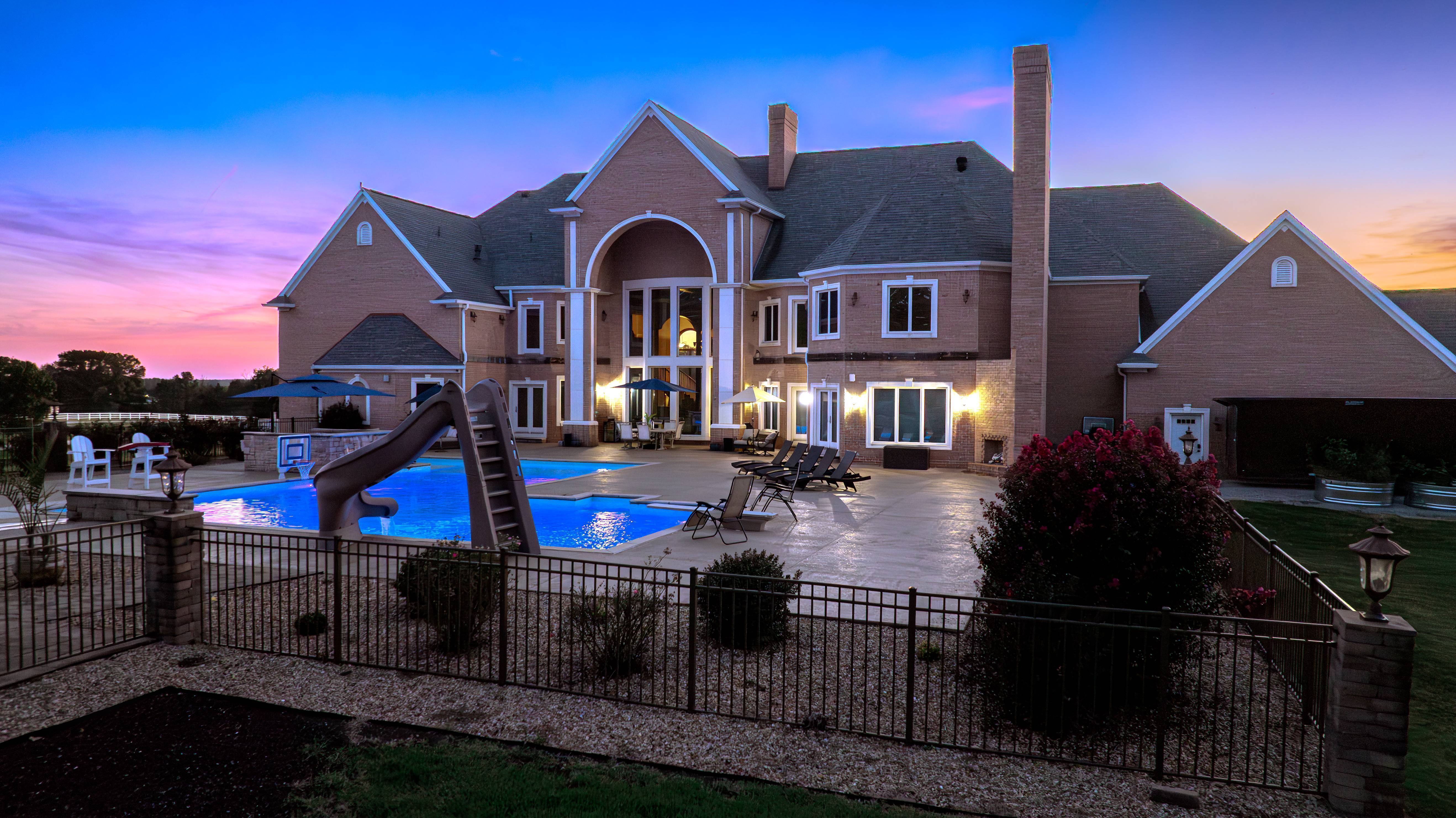 Luxury estate with pool and patio at sunset, 6708 Brown Ln, Poplar Bluff, Missouri &mdash; sold by Delta Realty LLC
